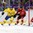 SOCHI, RUSSIA - FEBRUARY 14: Sweden's Alexander Steen #20 controls the puck around the net against Switzerland's Mark Streit #7 and Reto Berra #20 defends during men's preliminary round action at the Sochi 2014 Olympic Winter Games. (Photo by Andre Ringuette/HHOF-IIHF Images)